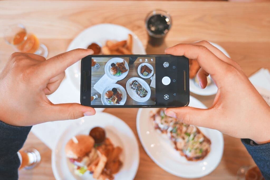 Person snapping food Unsplash Delightful Food And Beverage Trends For Hotels, Restaurants, And Bars In 2021